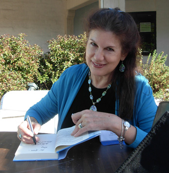 Mara Purl signs at the Central Coast Writer's Conference